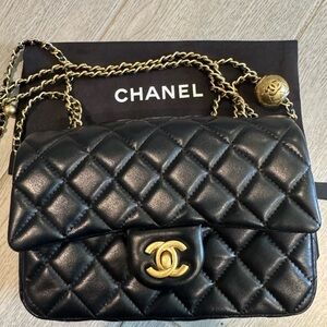 inspired black popular bag in the “small” size with smooth quilting design